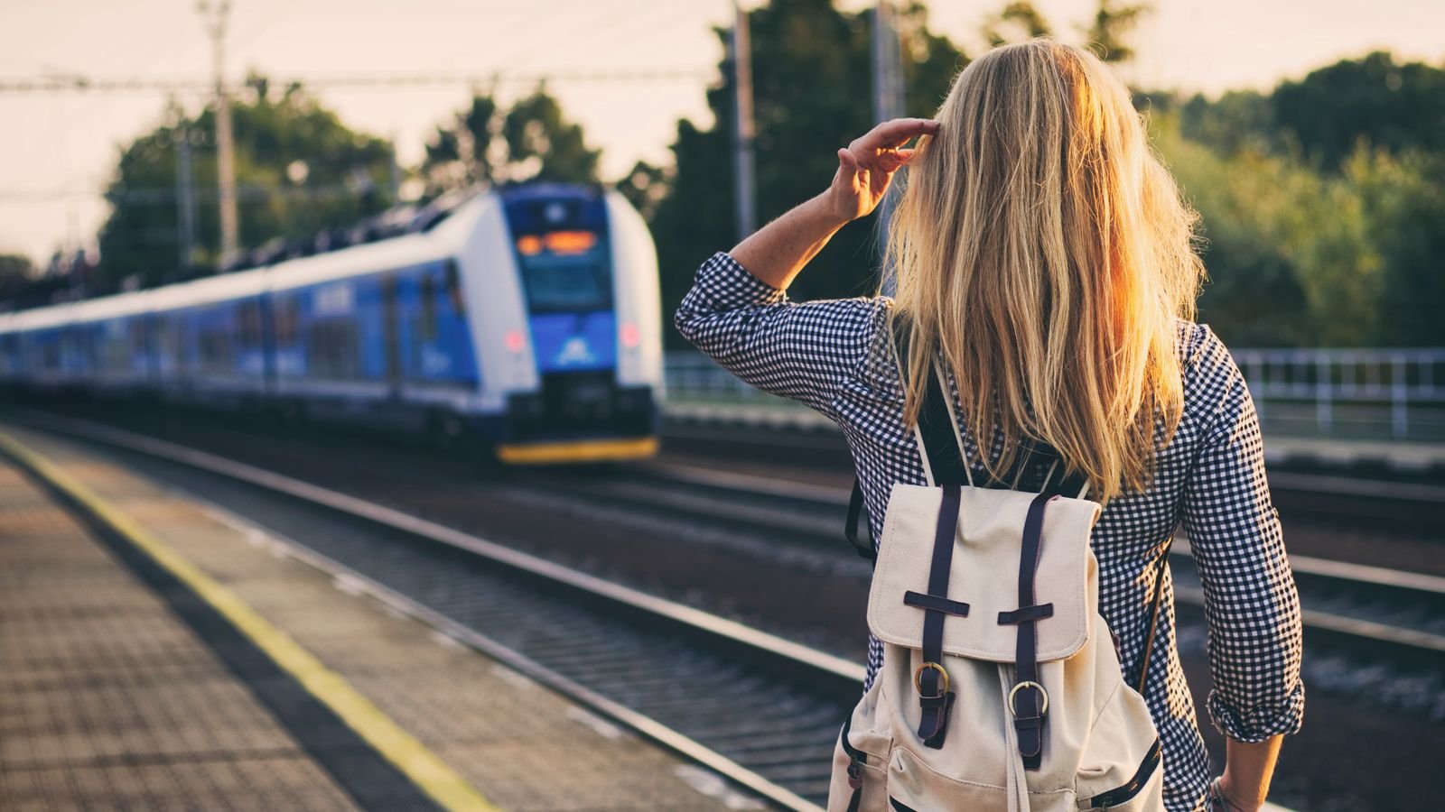Modern high-speed train waiting at a station platform