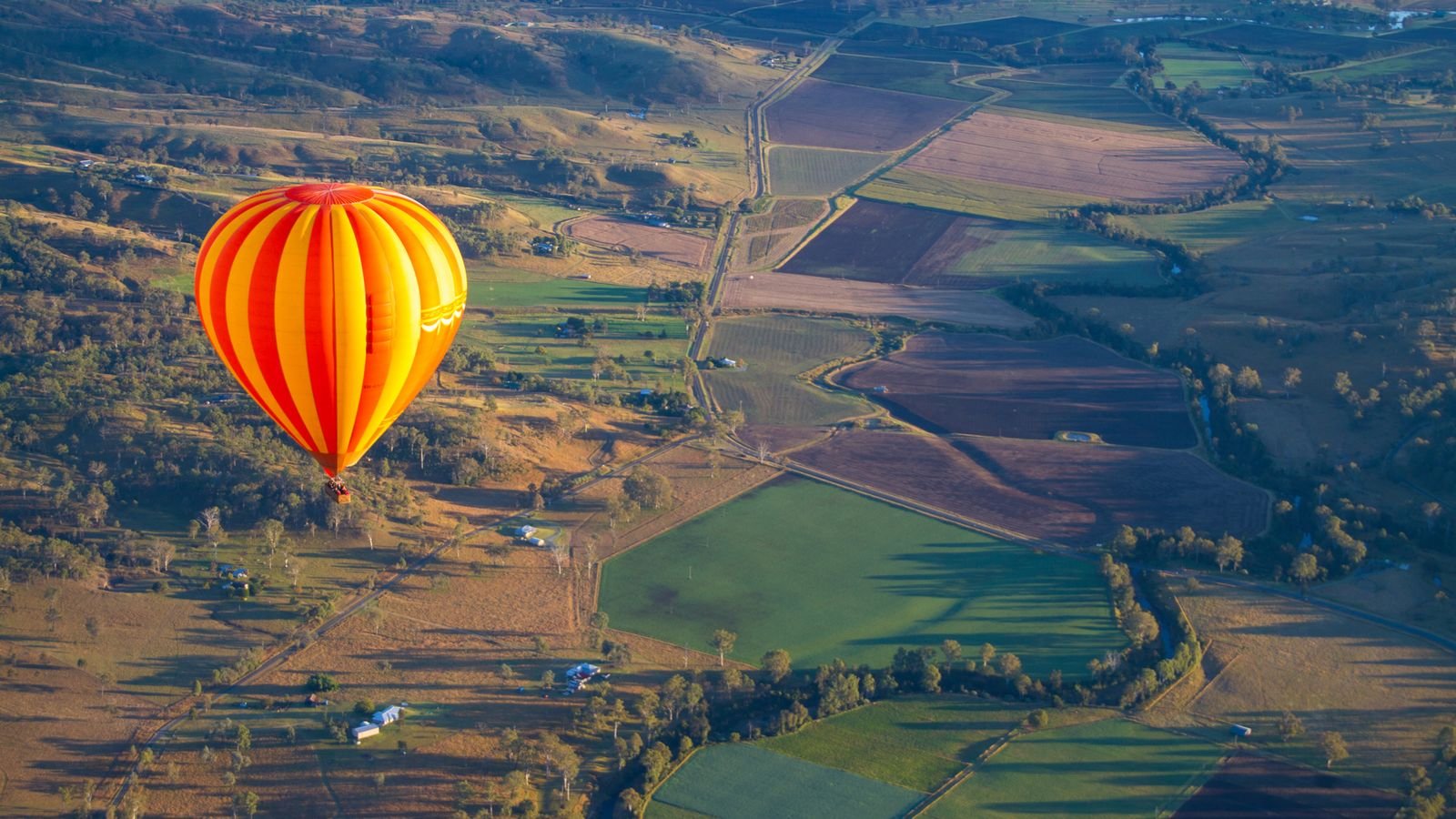 Hot air balloon basket preparing for sunrise takeoff