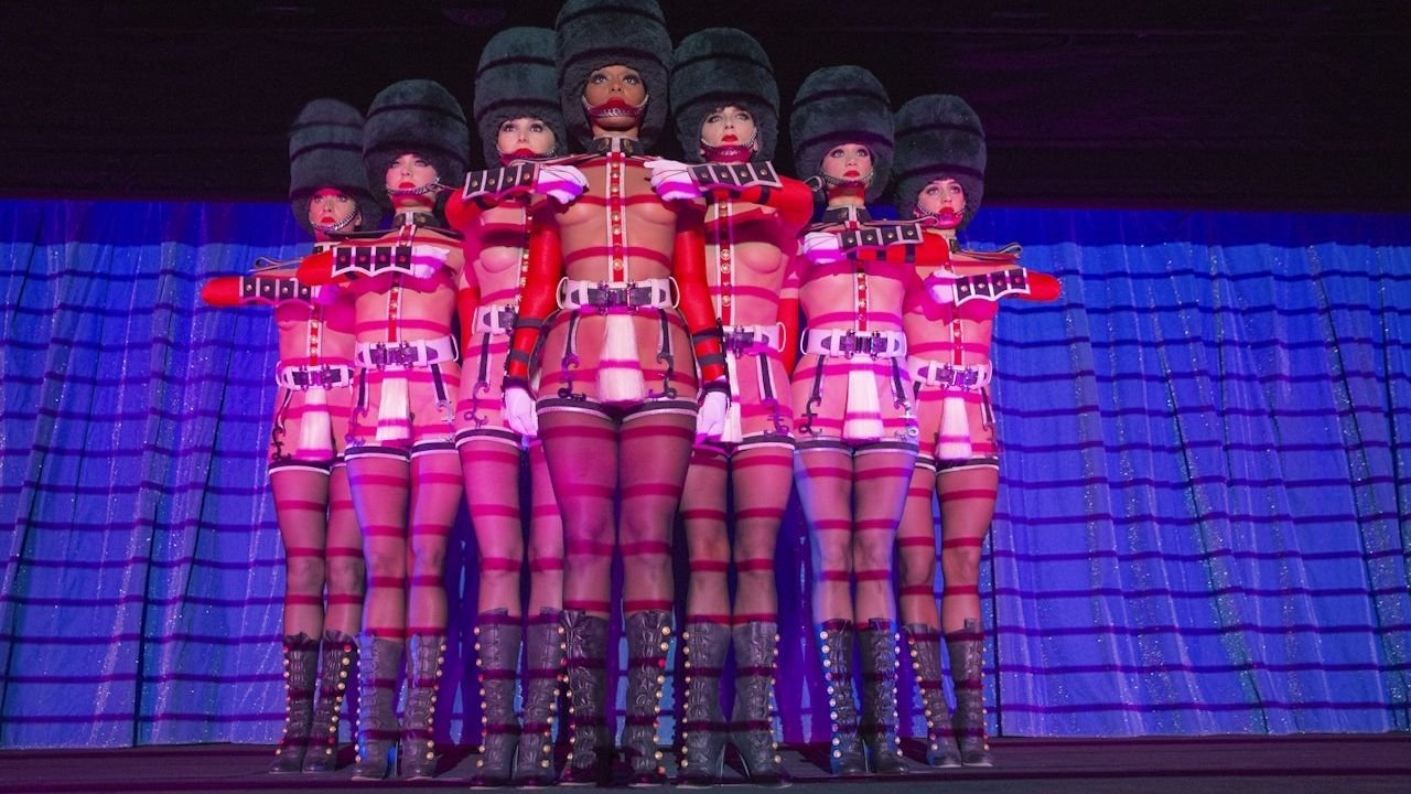 Choreographed dance act with silhouette lighting at Crazy Horse Paris