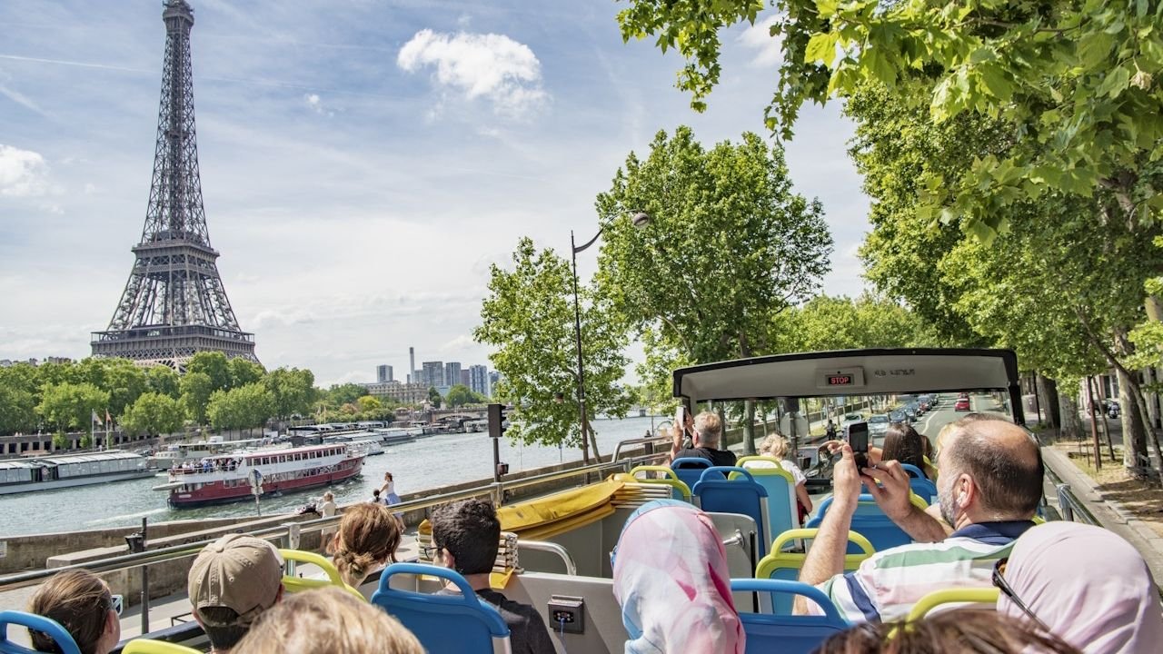 Tootbus open-top double-decker bus driving through Paris