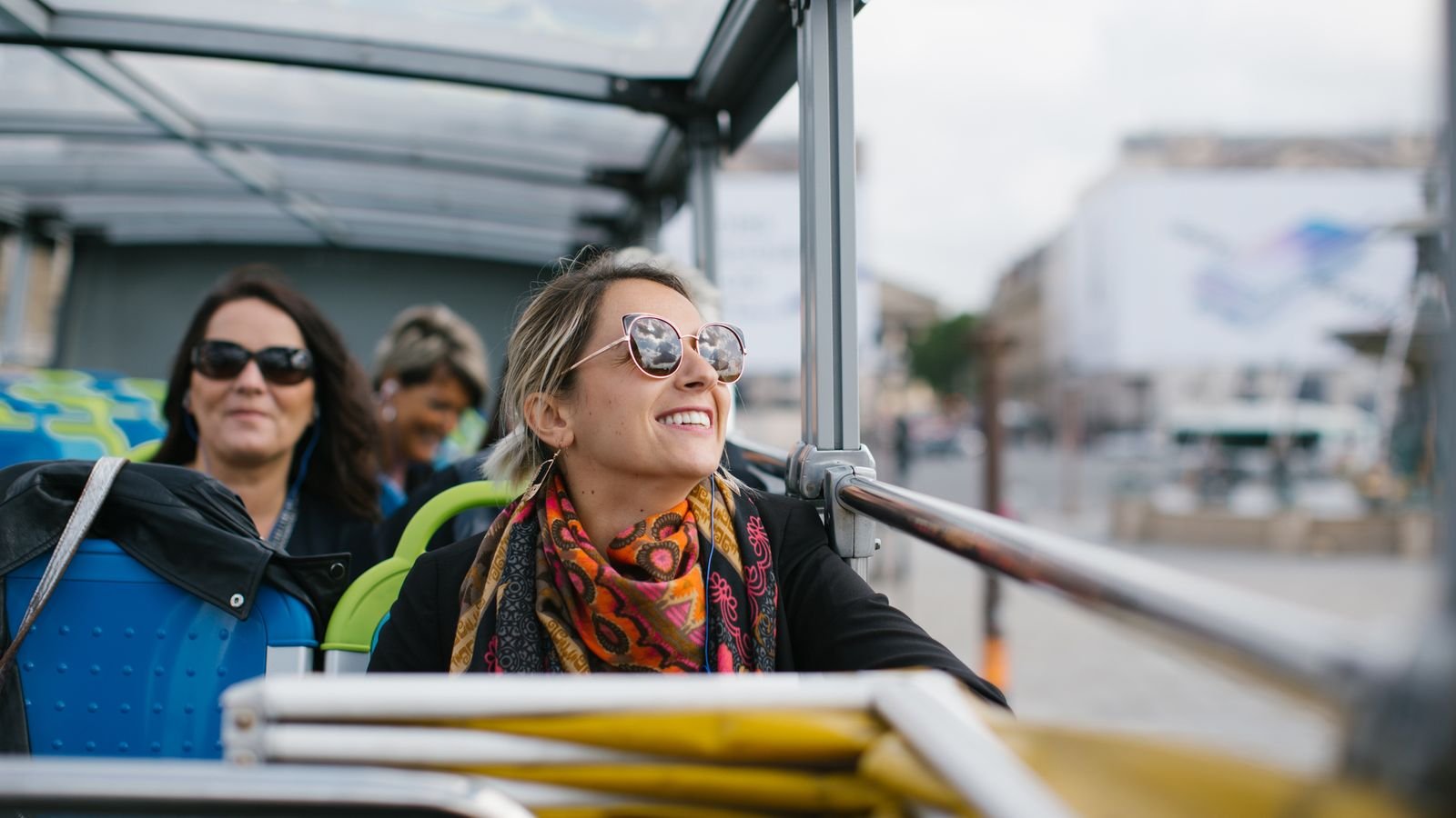 Open-air sightseeing bus crossing near Place de la Concorde