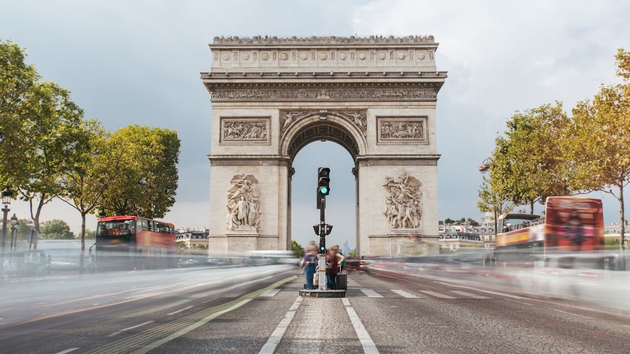 Exterior facade of the 50-meter Neoclassical Arc de Triomphe in Paris