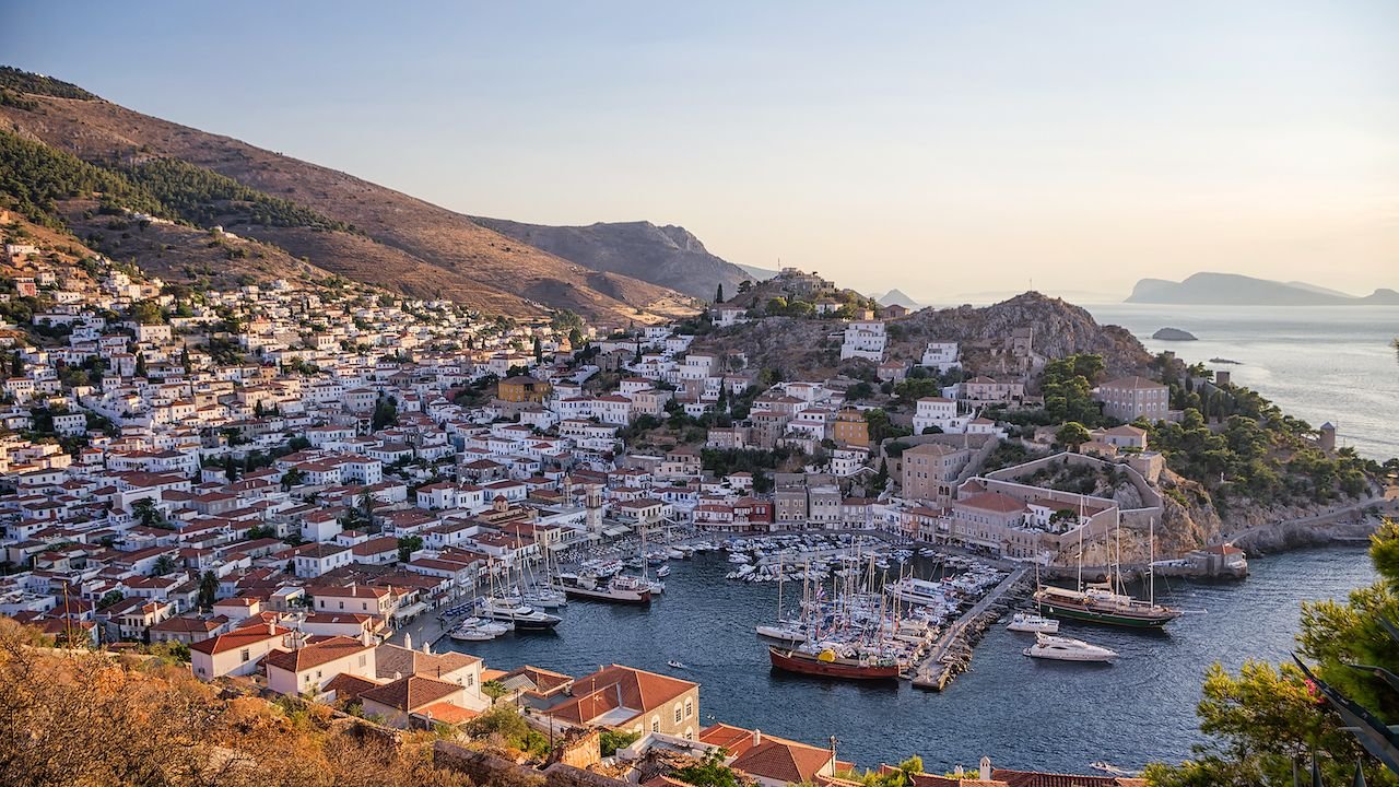 Hydra island historic harbor with stone houses