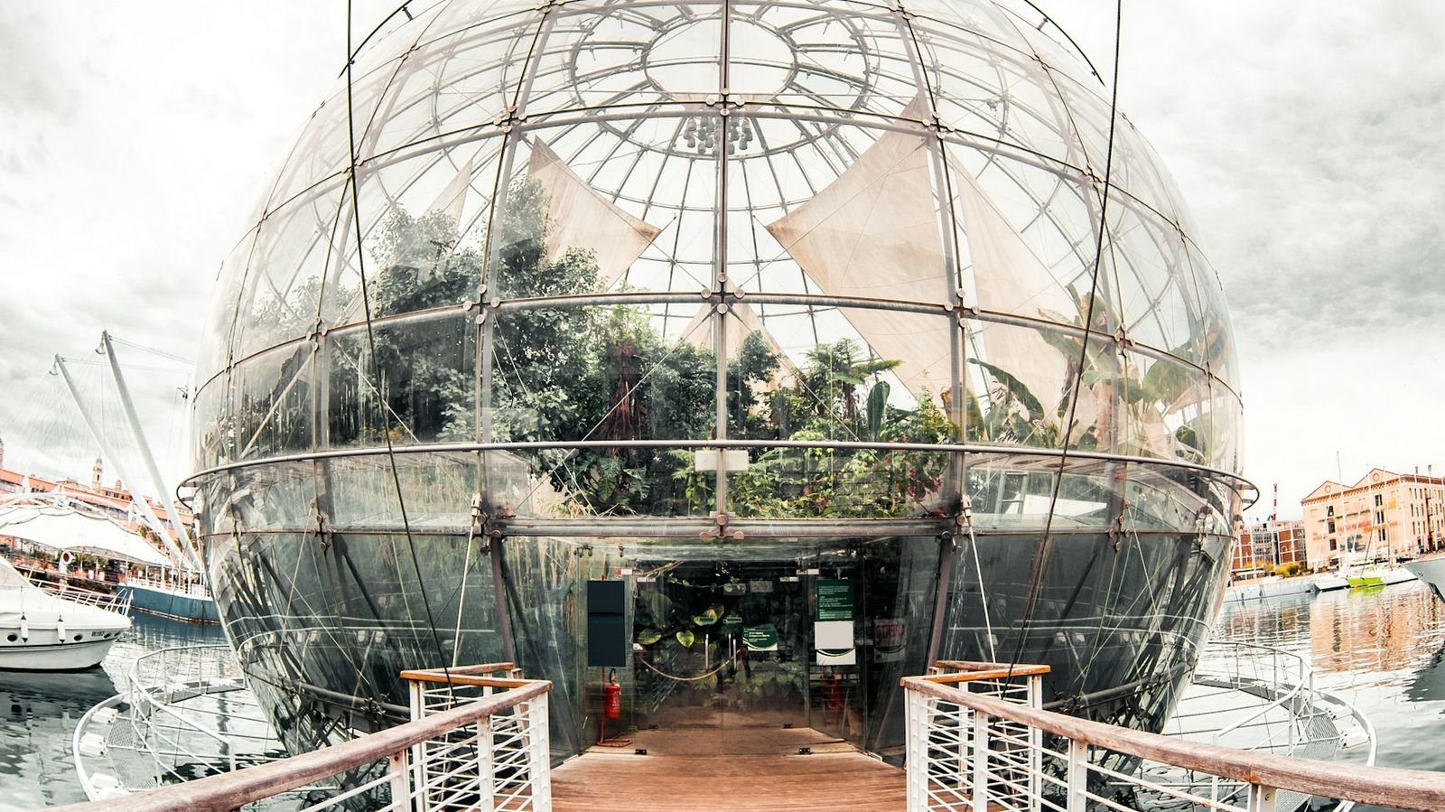 Glass-and-steel sphere of the Biosphere at Genoa's Old Port designed by Renzo Piano