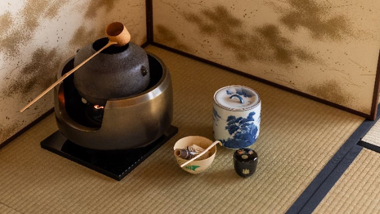 Instructor demonstrating the Japanese tea ceremony ritual beside Fushimi Inari Shrine