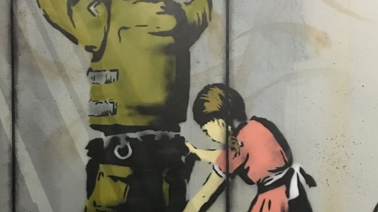Immersive street scene installation at The World of Banksy Paris