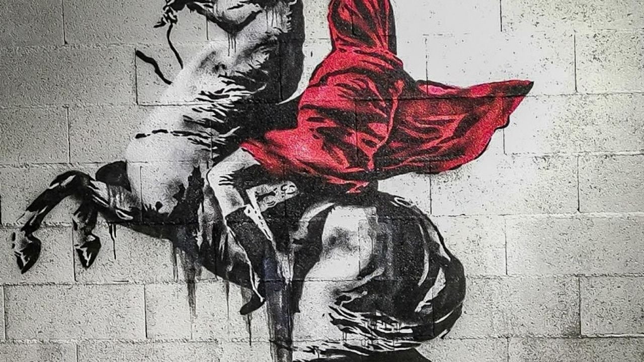 Video projection gallery inside The World of Banksy exhibition