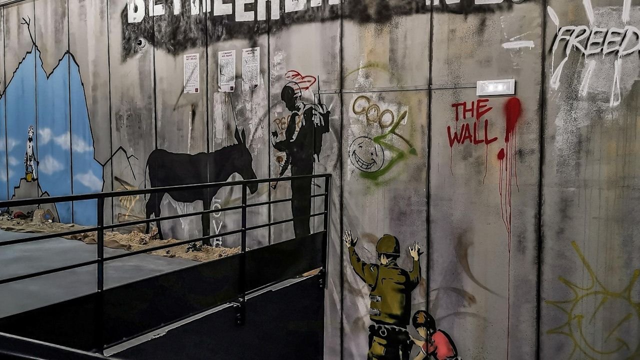 Exhibition hall showcasing over 100 recreated Banksy artworks
