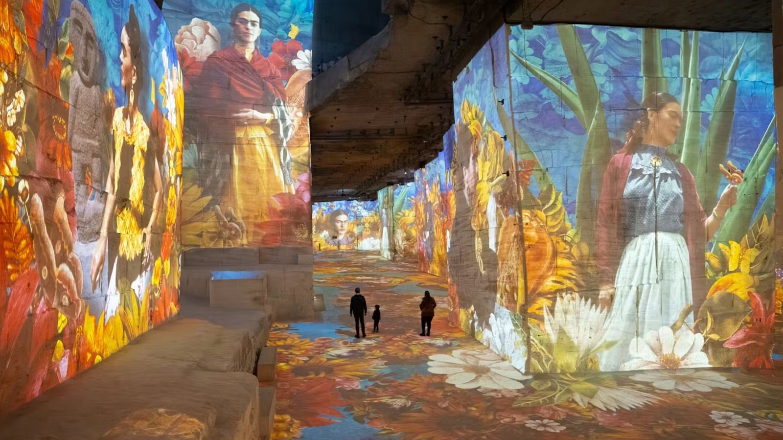Visitors exploring the digital art exhibition in France