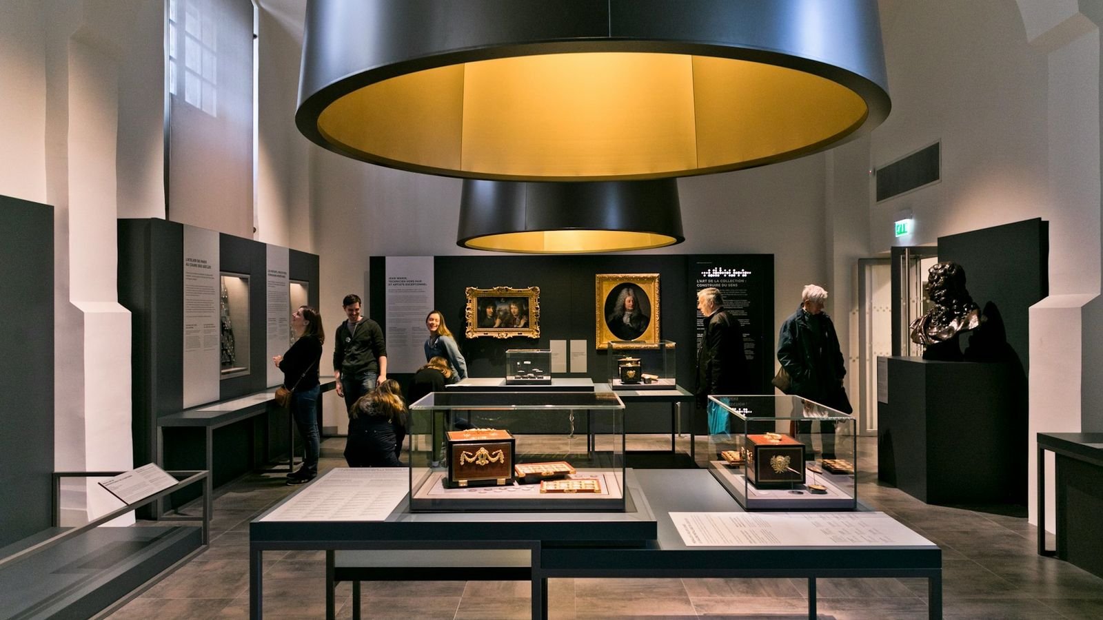 Sensory displays showing the transformation of metal into coins