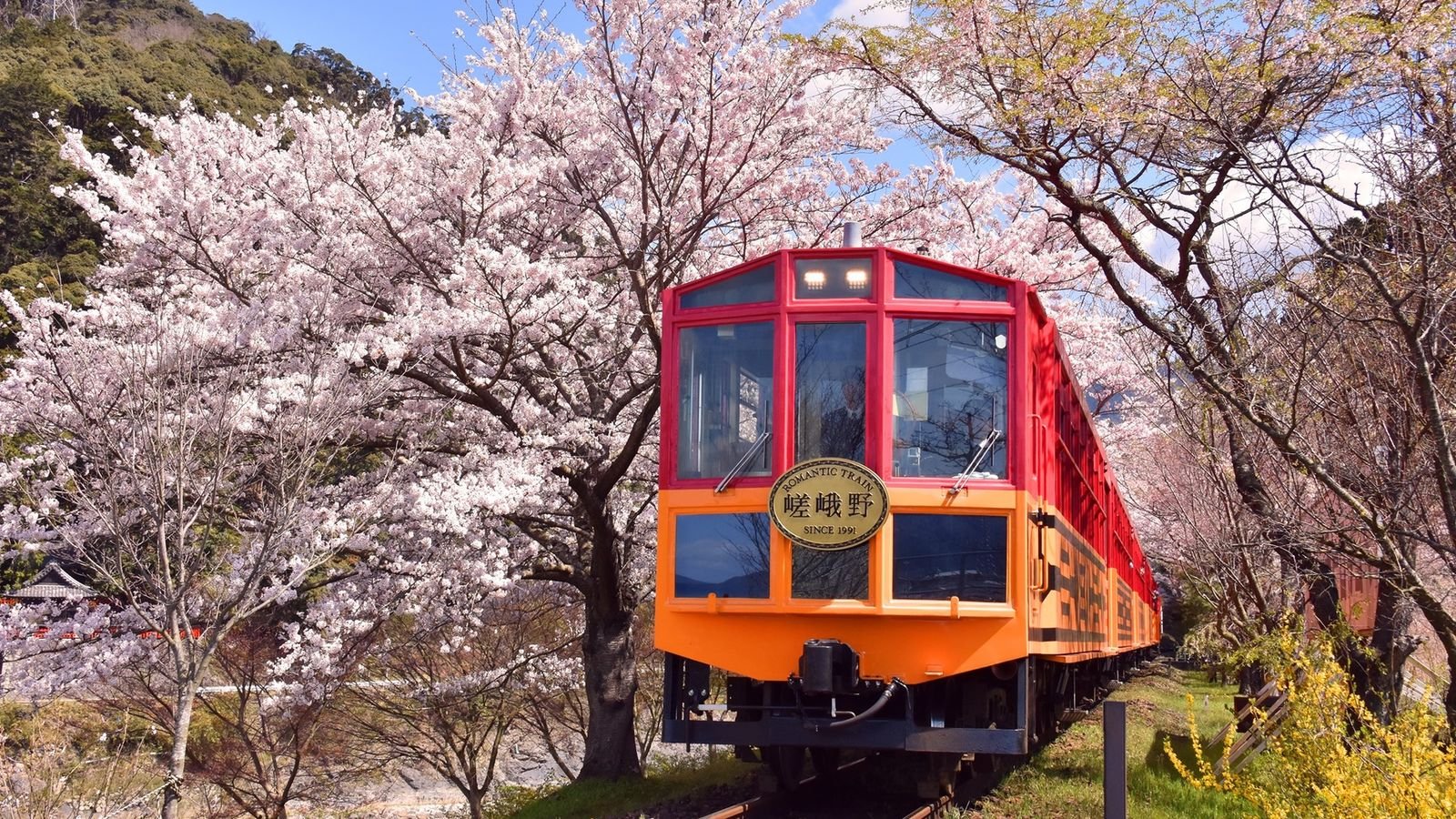 Sagano Romantic Train red art deco locomotive with gold and black patterns