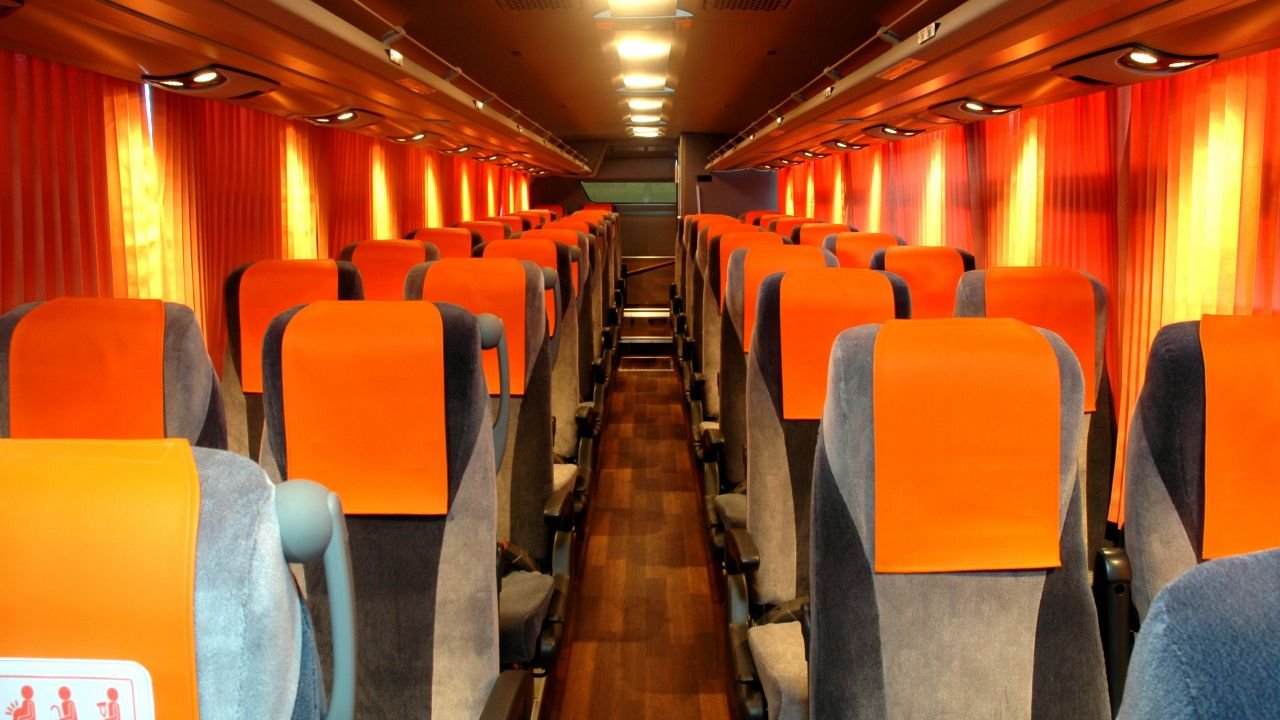 Onboard passenger seats with accessible charging ports
