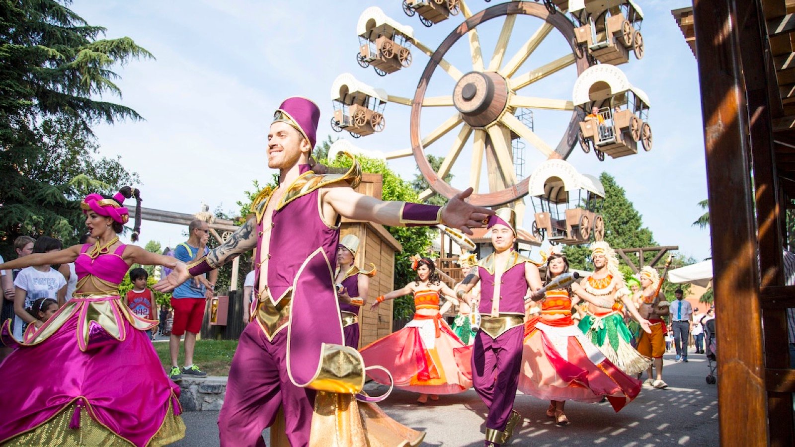Families walking through themed park areas