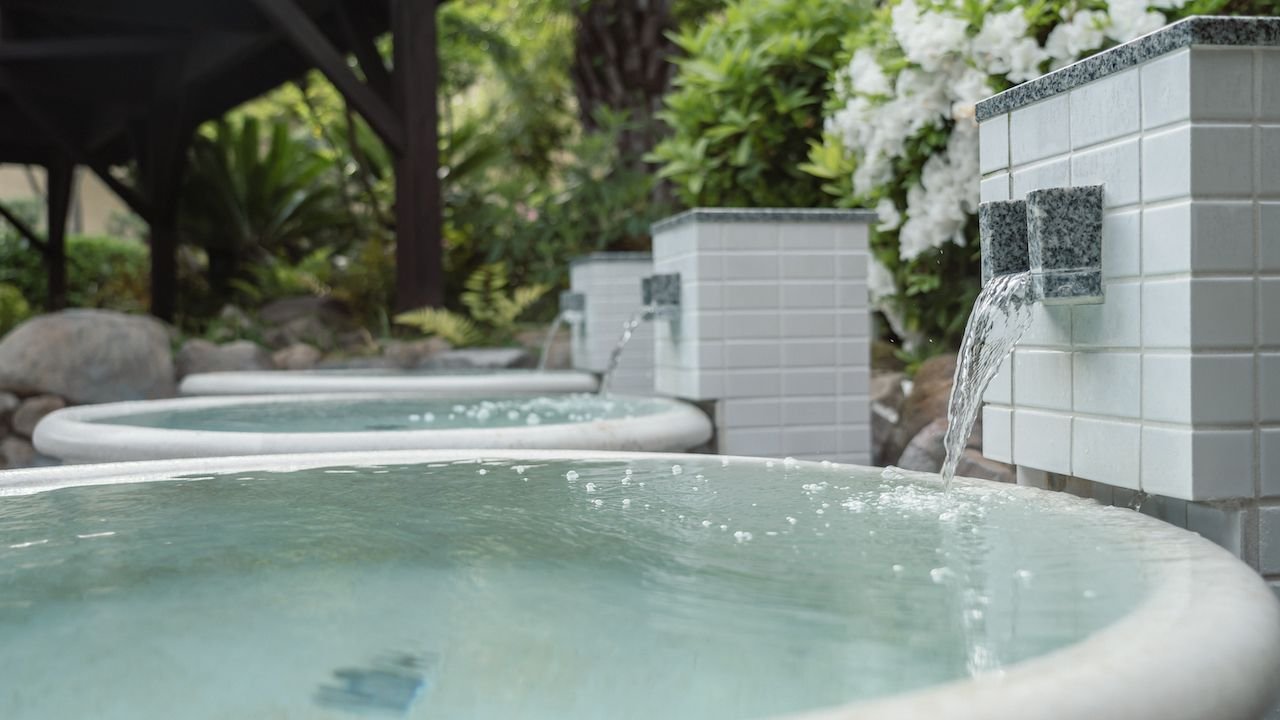 Top-floor outdoor hot spring bath with Osaka city views