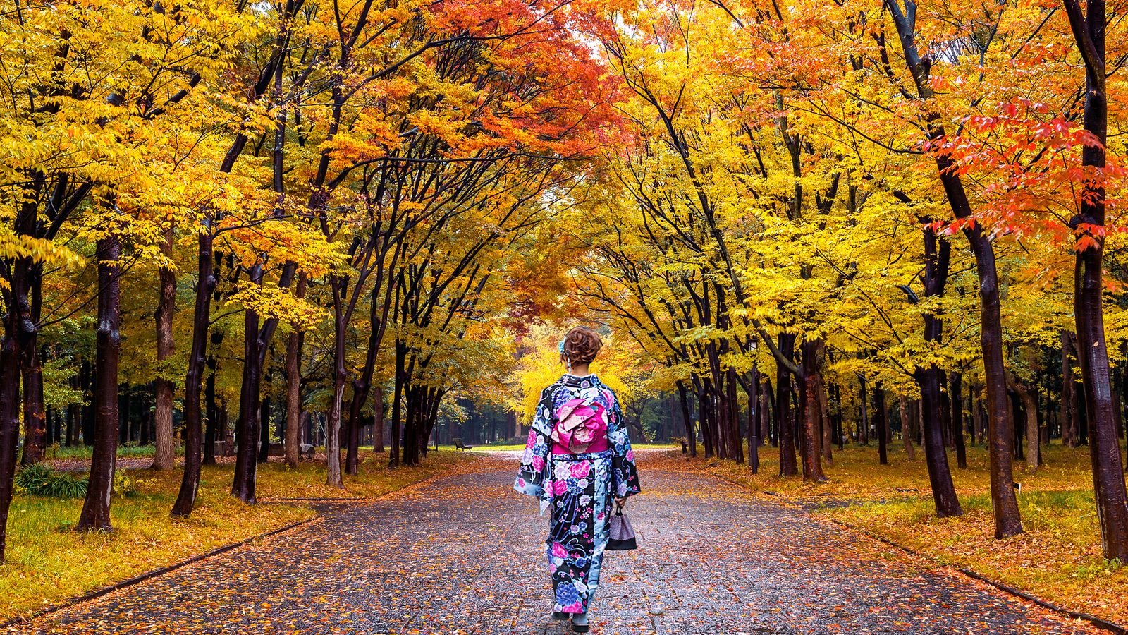 Traveler posing near cultural icons in Tokyo