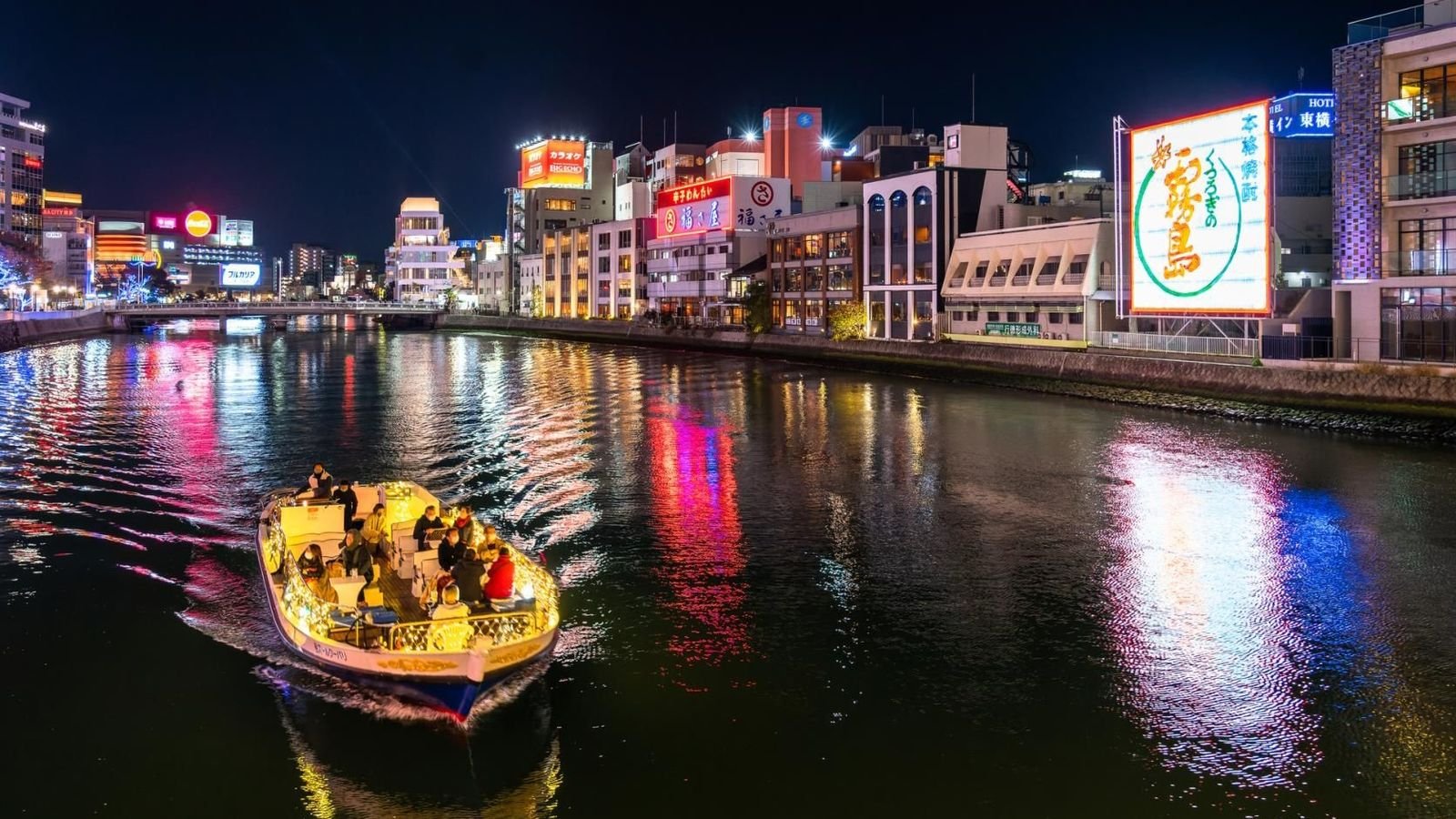 Fukuoka Tower and PayPay Dome viewed from the Hakata Bay cruise