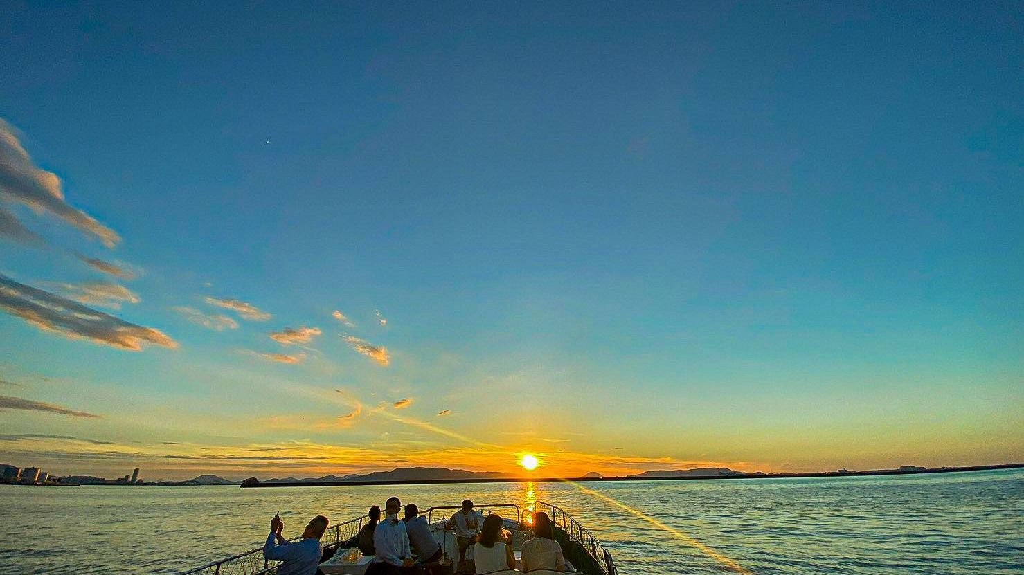 Passengers enjoying the open-air sightseeing cruise in Fukuoka
