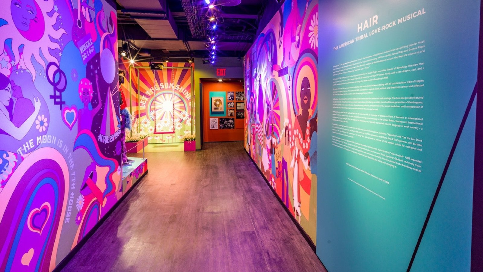Visitors exploring theatrical storytelling and choreography exhibits