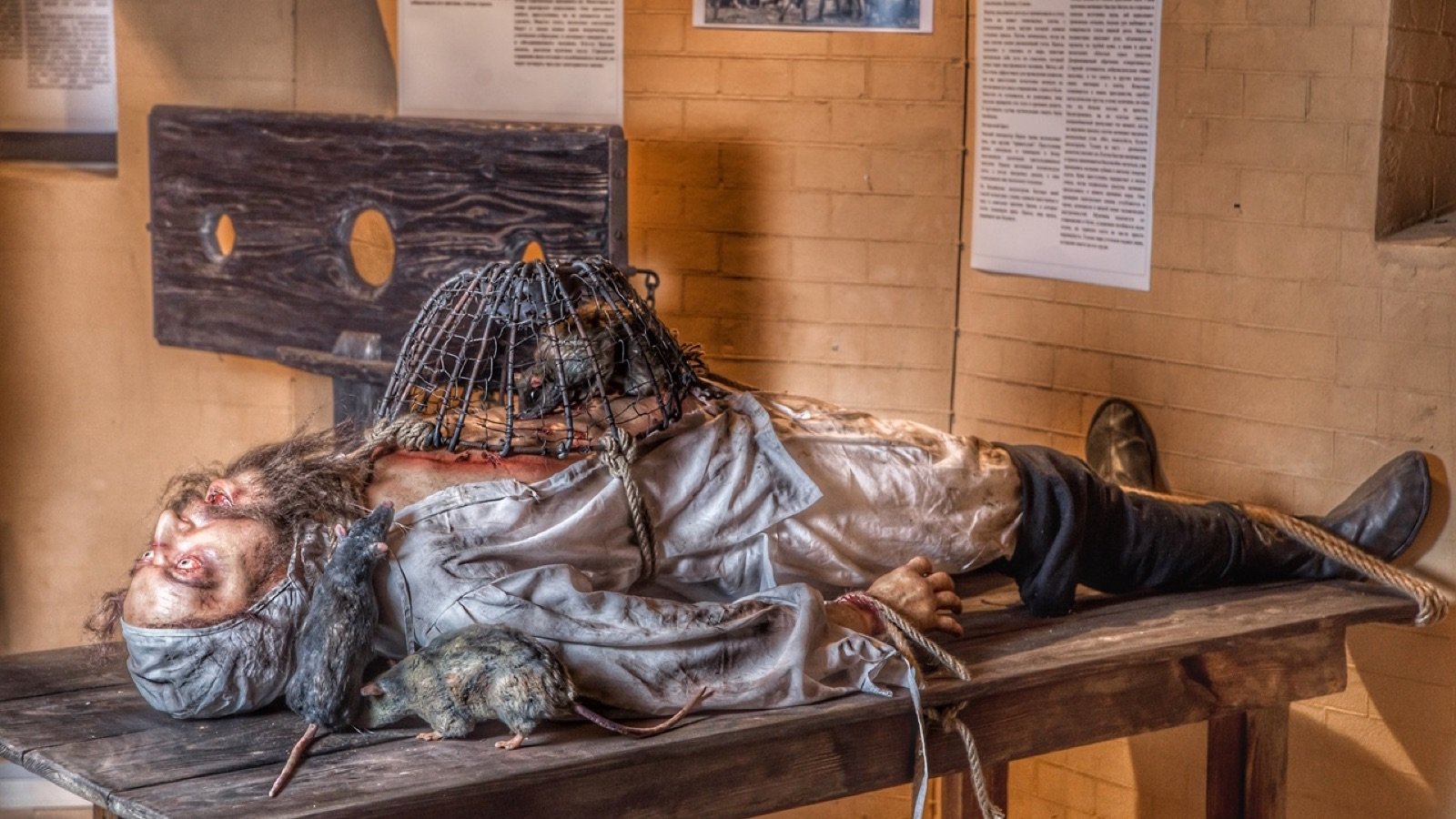 Mannequin scene depicting historical punishments inside Medieval Torture Museum