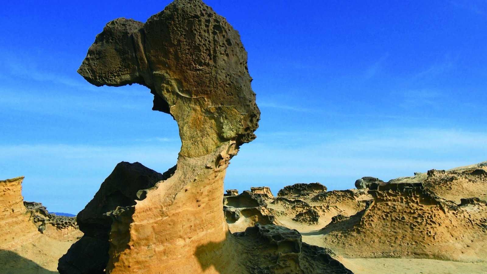 Mars-like rock formations and walking paths at Yehliu Geopark