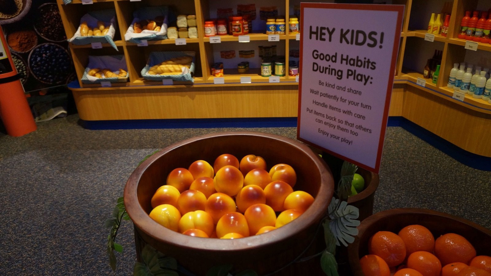 Toddlers exploring hands-on science activities at KidsSTOP Singapore
