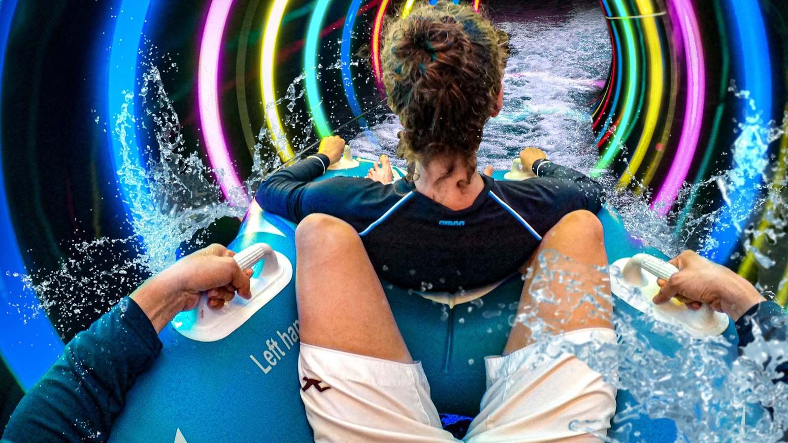 Riders enjoying water slides at SplashMania Waterpark