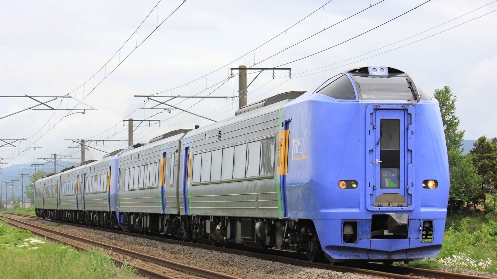 JR Hokkaido train traveling on the railway line