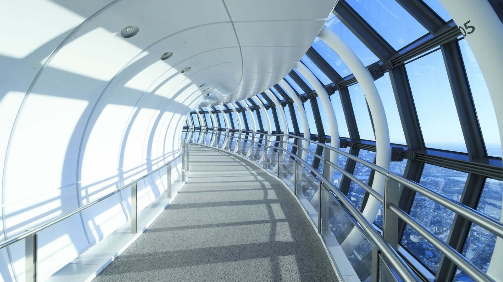 Visitors walking along the curved pathway of Tokyo Skytree Tembo Galleria