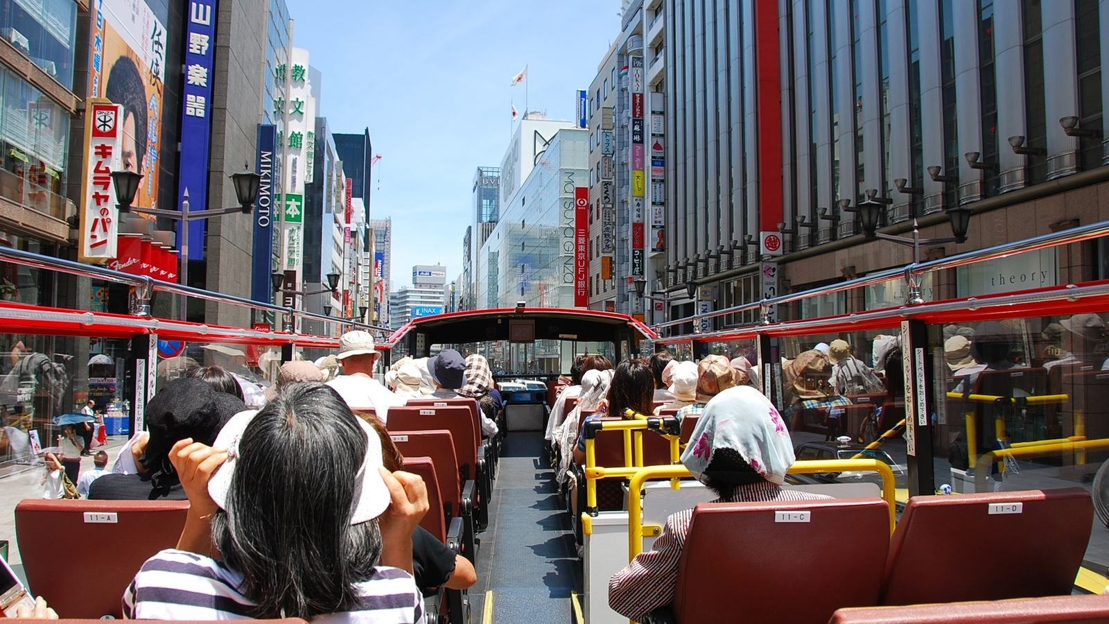 Tokyo Sky Hop-on Hop-off double-decker bus on city street