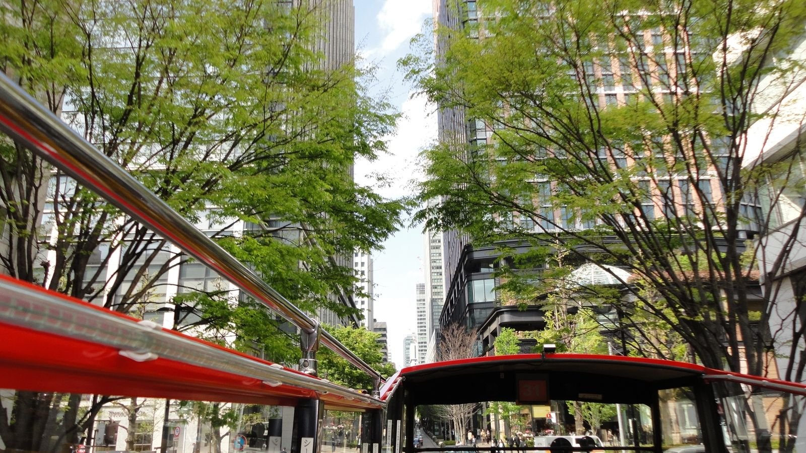 Red Line bus traveling near Tokyo Skytree Station
