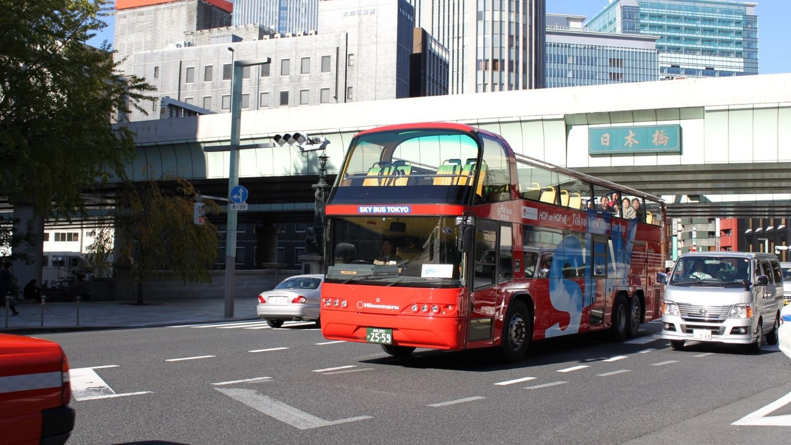 Green Line sightseeing bus passing Shinjuku Gyoen National Garden