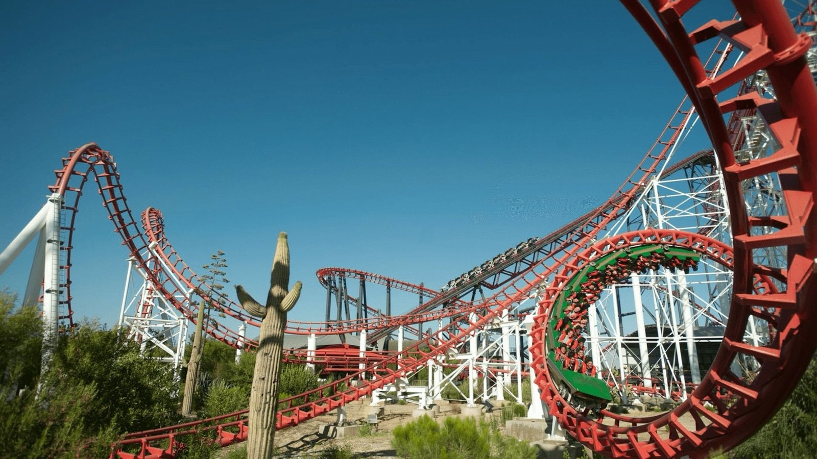 Thrill ride train speeding along the rails